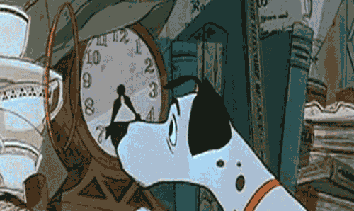 A dog pushes forward the hands on a clock.